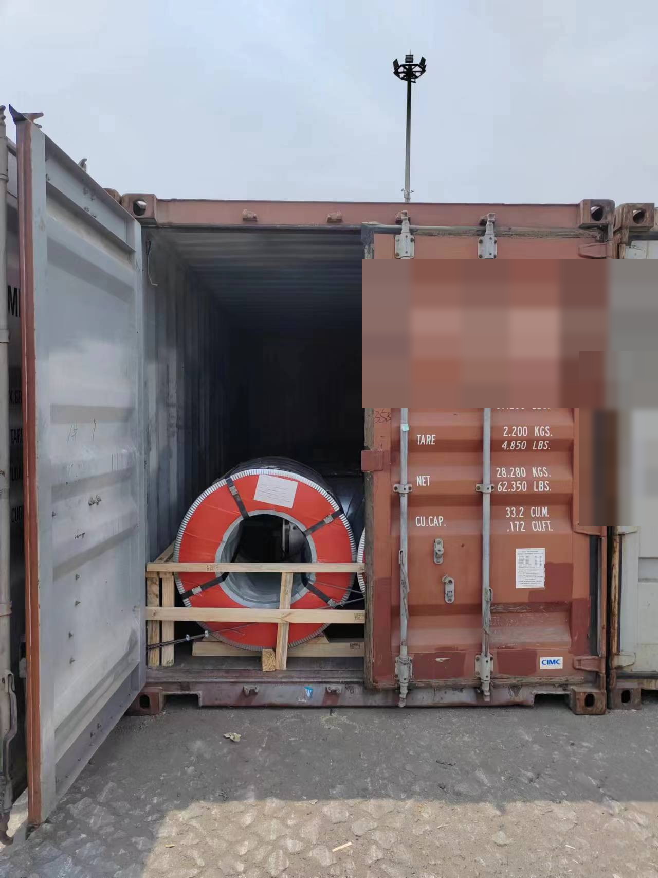 Steel coils loaded in a container at the warehouse
